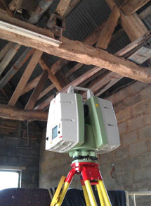 Laser scanner in barn with exposed roof timbers